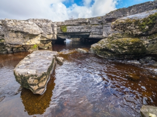 The river Greta flowing under the limestone arch of God&#039;s Bridge, Teesdale