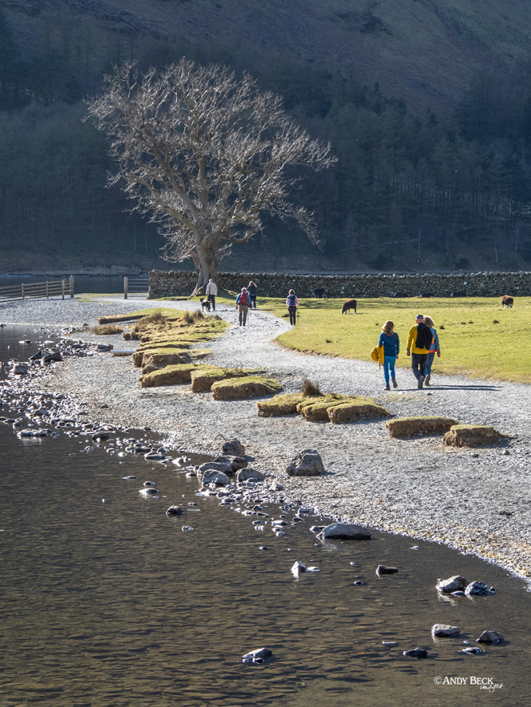 Walking around Buttermere, walkers on the shore path of Buttermere Lake