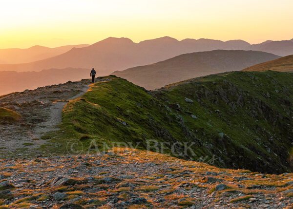 Ridgewalking on Coniston Old Man in the Lake District one evening as the sun sets